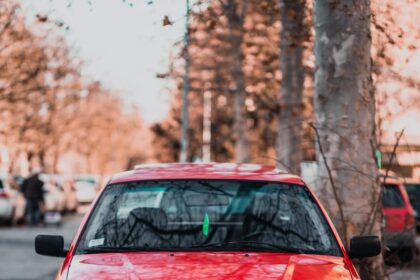 red bmw m 3 on road during daytime