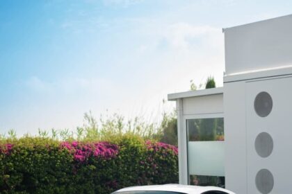 white lamborghini aventador parked near white concrete building during daytime